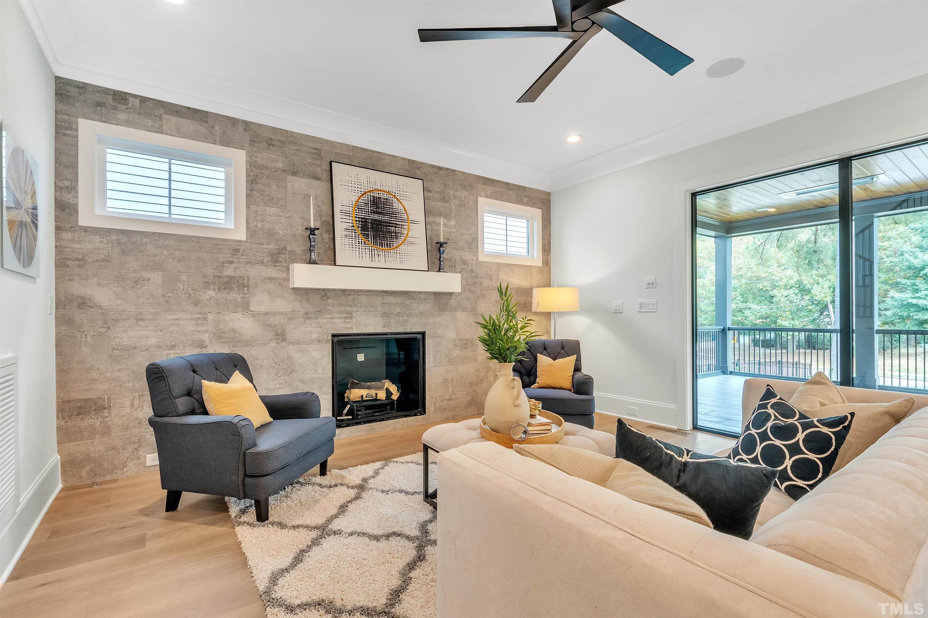 2000 Pine Drive Raleigh, NC 27608 - Photo 15 of 39 a living room with furniture and a fireplace