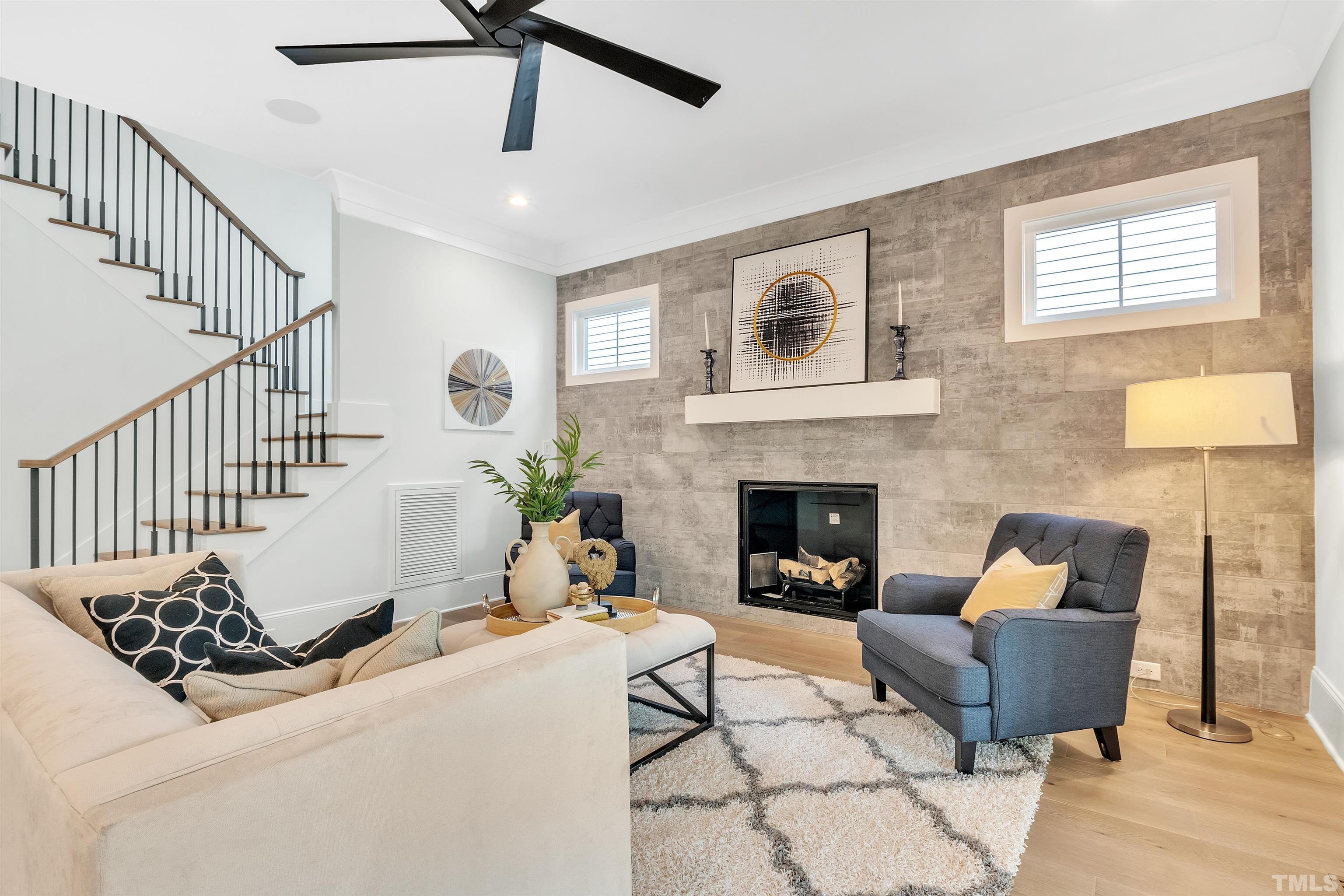 2000 Pine Drive Raleigh, NC 27608 - Photo 16 of 39 a living room with furniture and a fireplace