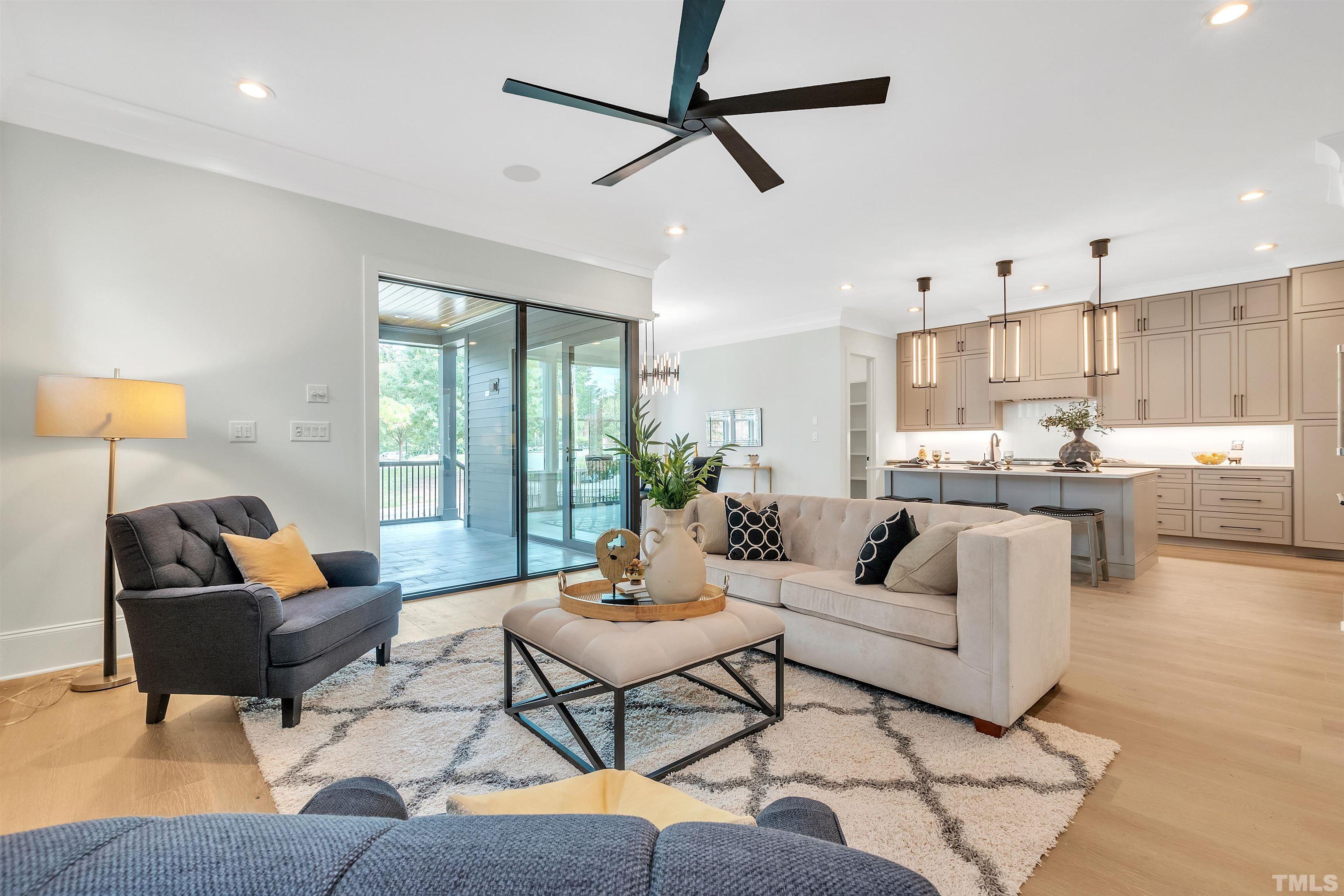 2000 Pine Drive Raleigh, NC 27608 - Photo 17 of 39 a living room with furniture and a large window