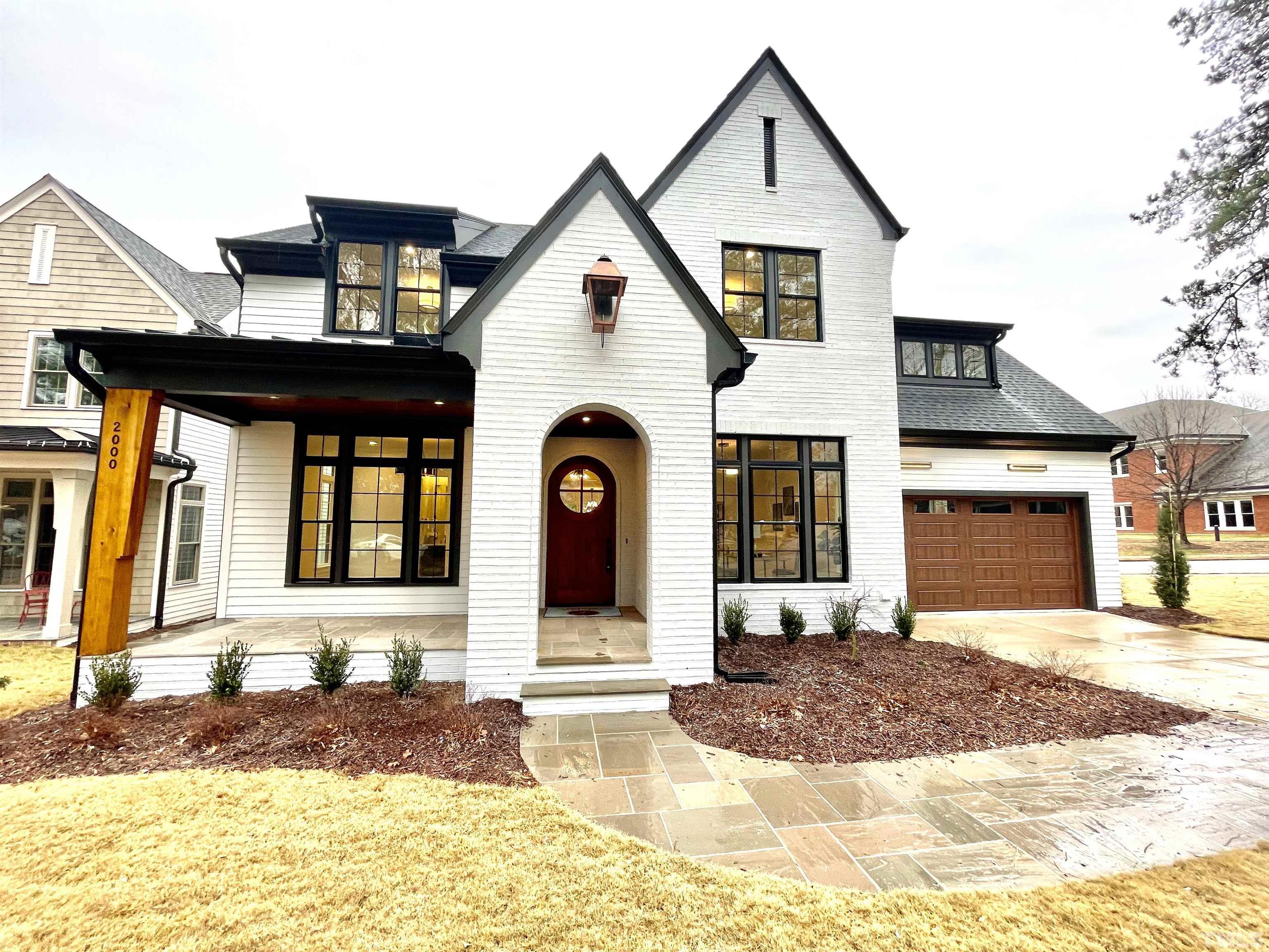 2000 Pine Drive Raleigh, NC 27608 - Photo 2 of 39 a front view of a house with a yard