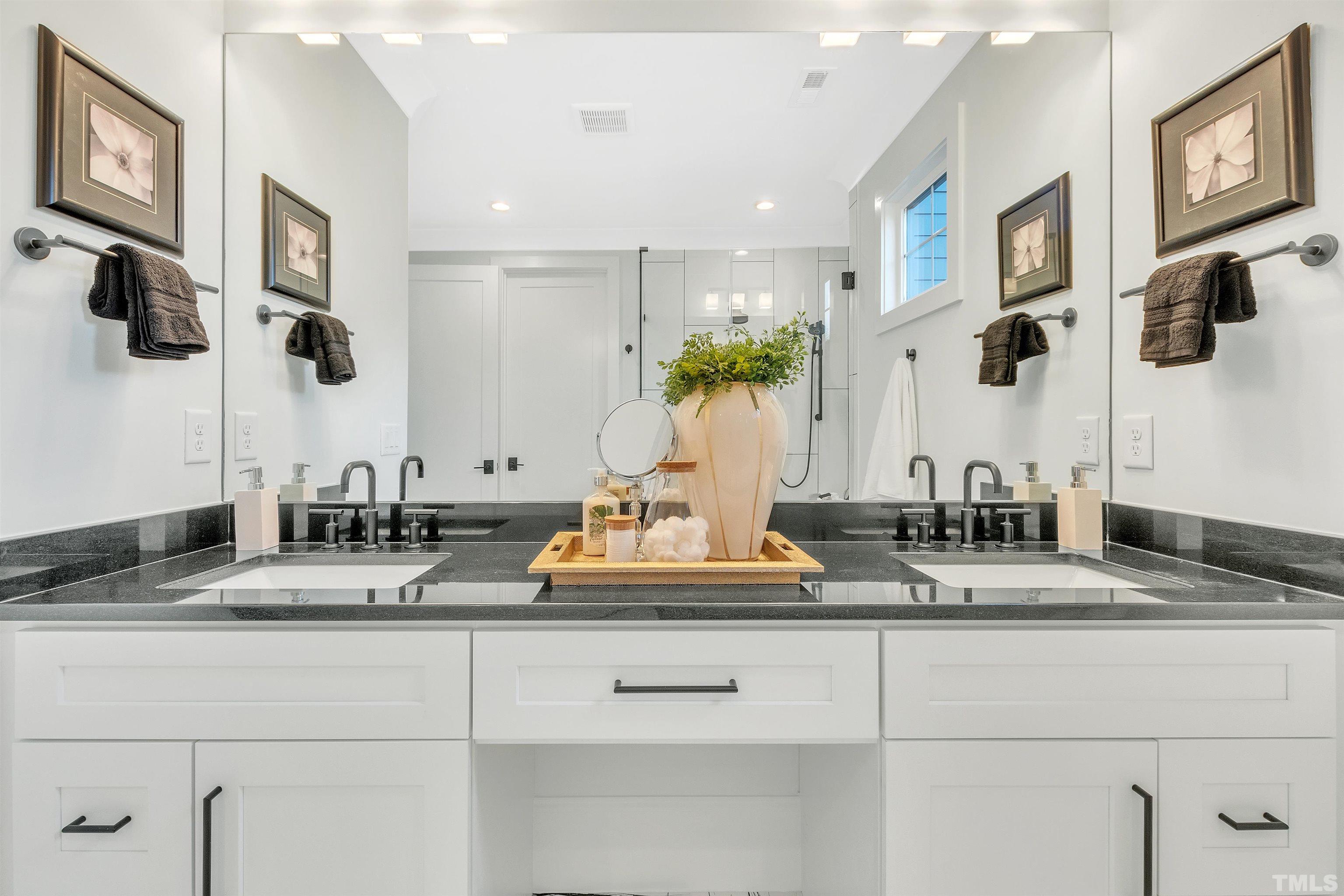 2000 Pine Drive Raleigh, NC 27608 - Photo 28 of 39 a bathroom with sinks granite vanity and a mirror