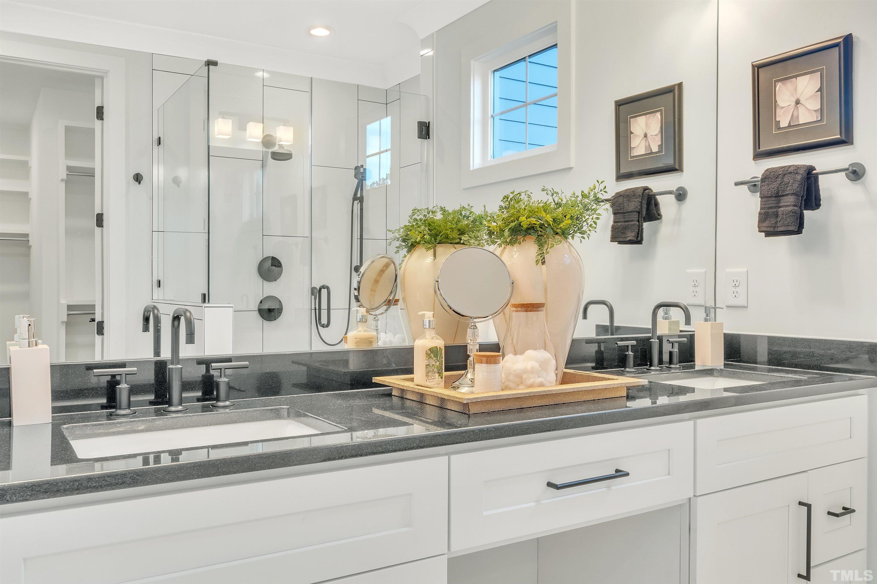 2000 Pine Drive Raleigh, NC 27608 - Photo 29 of 39 a bathroom with double vanity sinks and a mirror