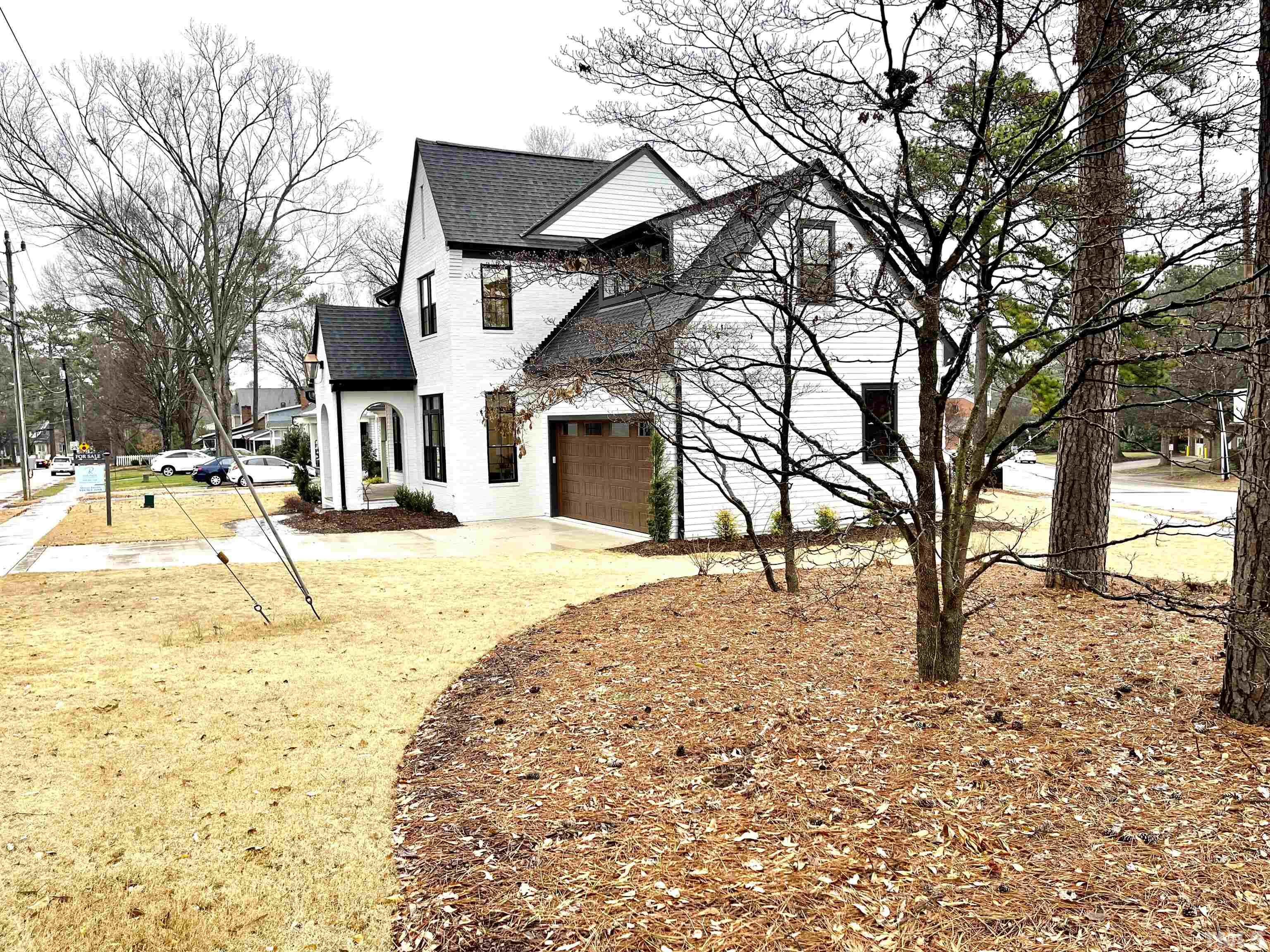 2000 Pine Drive Raleigh, NC 27608 - Photo 3 of 39 a view of a yard with a house