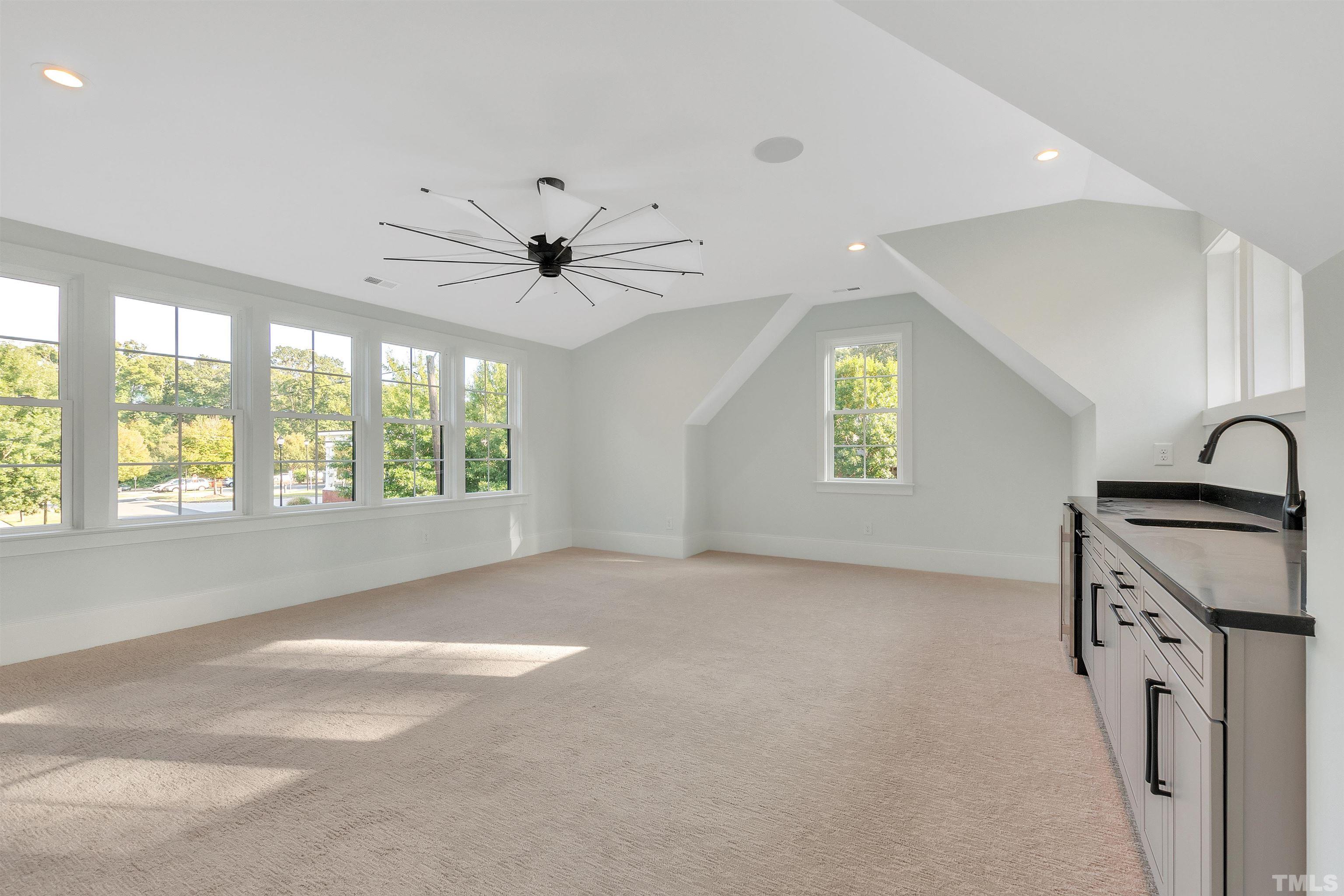2000 Pine Drive Raleigh, NC 27608 - Photo 33 of 39 a view of a kitchen with a sink dishwasher and a large window