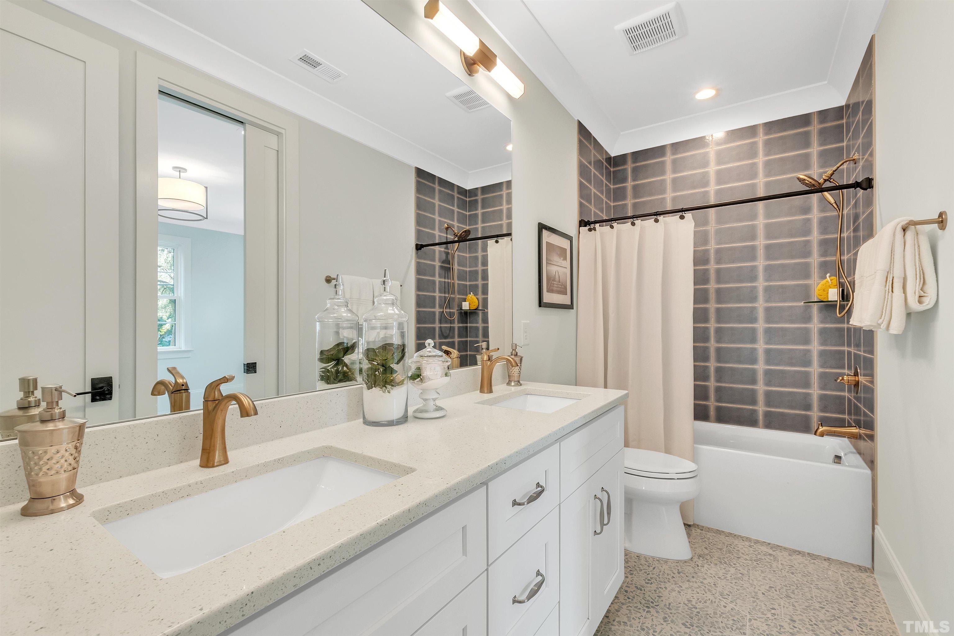2000 Pine Drive Raleigh, NC 27608 - Photo 35 of 39 a bathroom with a double vanity sink toilet and shower