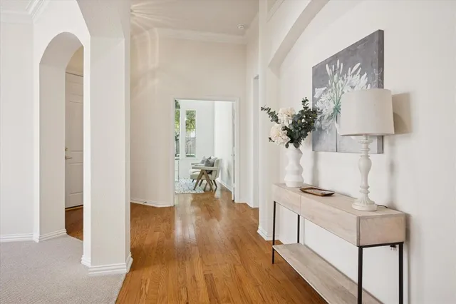 a view of a workspace with furniture and wooden floor