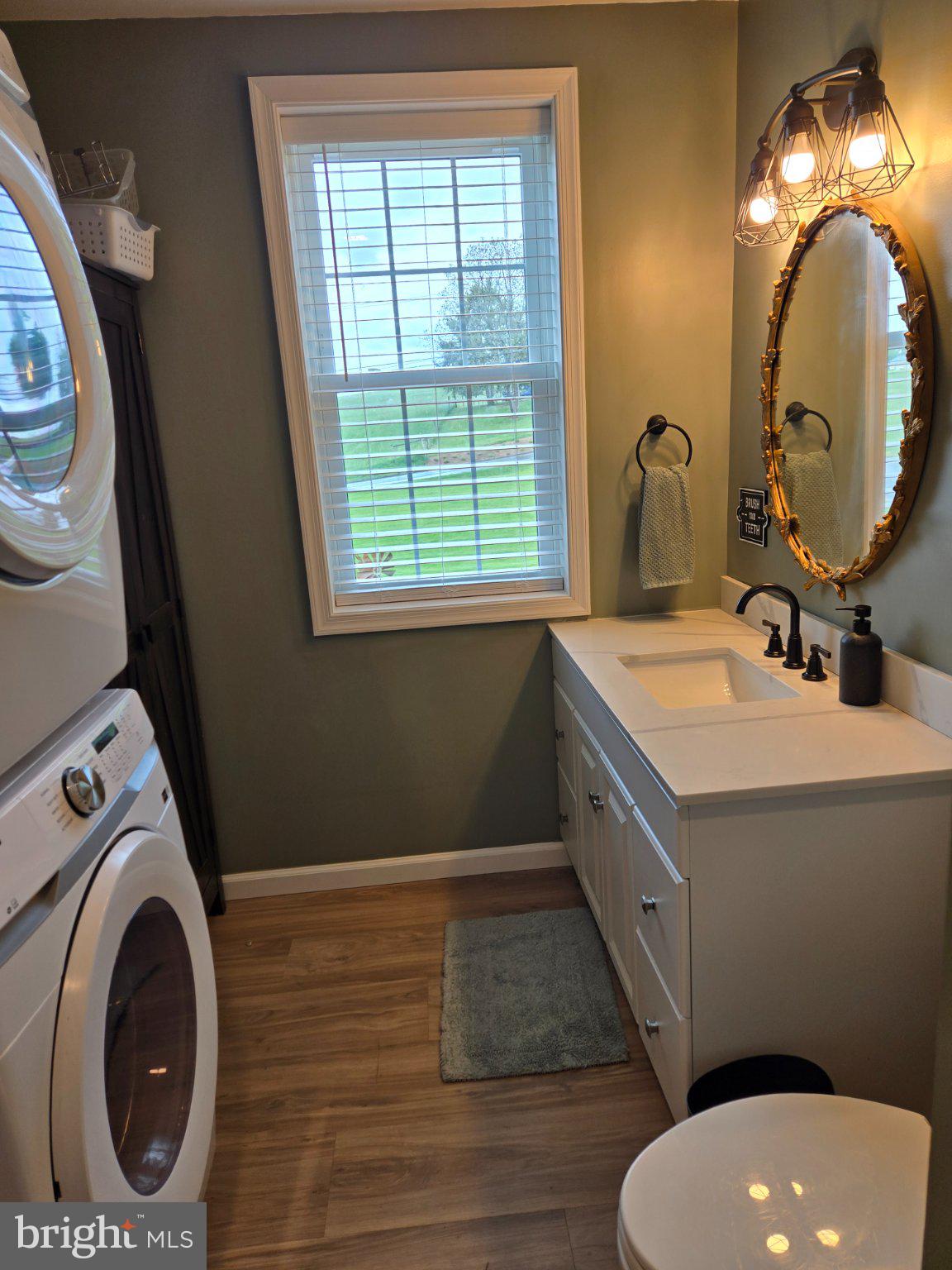 1669 Colebrook Road Lebanon, PA 17042 - Photo 24 of 34 a bathroom with a sink mirror vanity and toilet