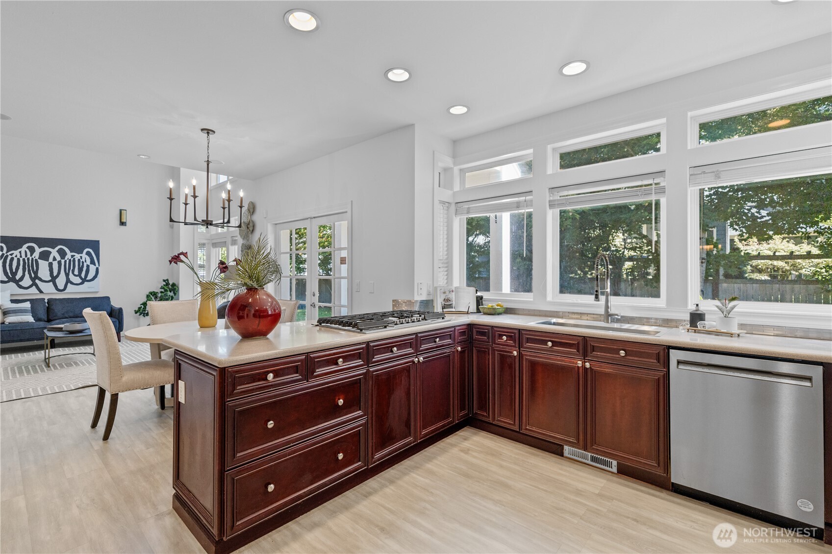 5217 76th Ave Court West University Place, WA 98467 - Photo 11 of 36 a kitchen with stainless steel appliances granite countertop wooden cabinets and a sink