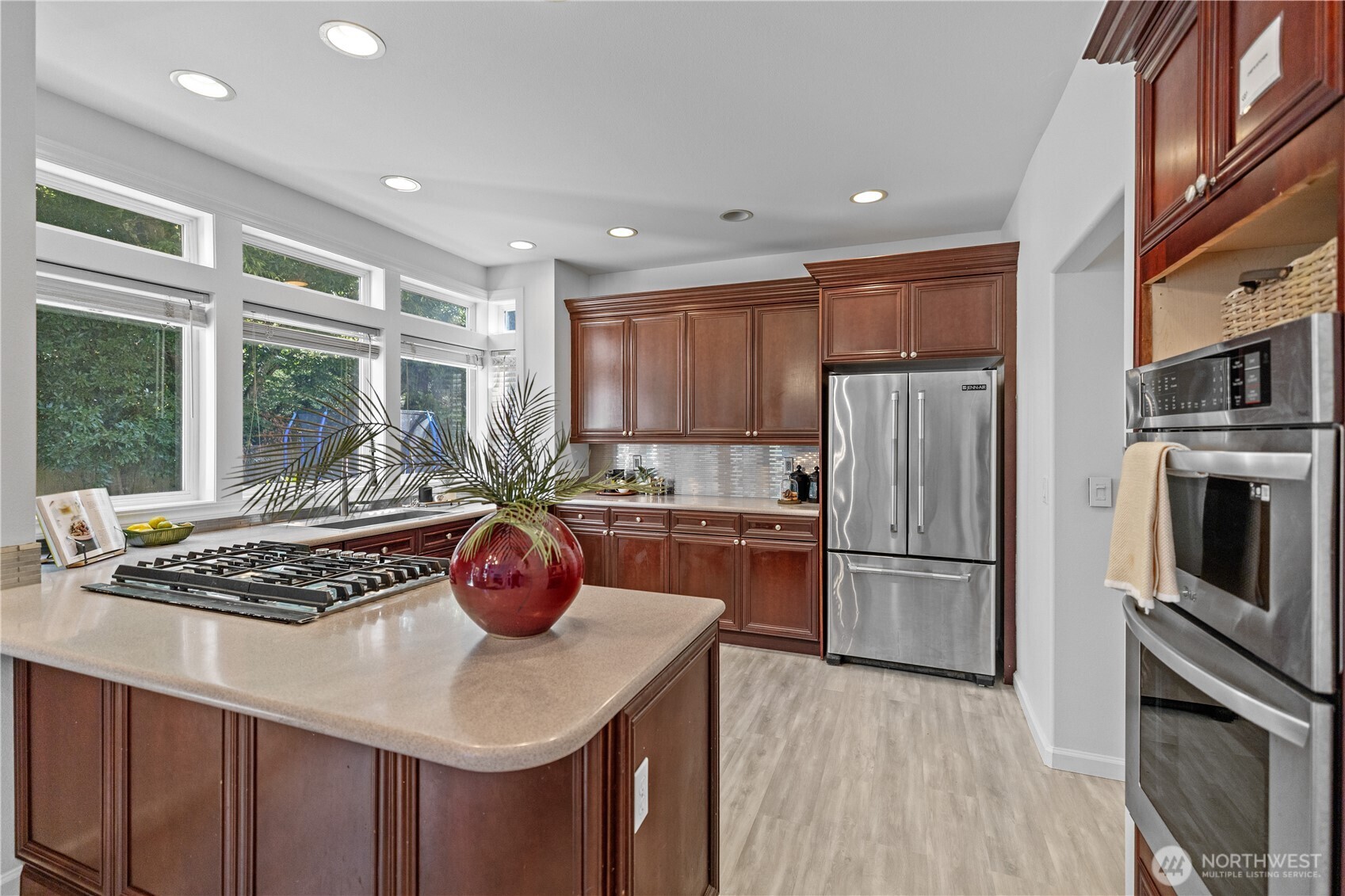 5217 76th Ave Court West University Place, WA 98467 - Photo 12 of 36 a kitchen with stainless steel appliances granite countertop a sink refrigerator and stove
