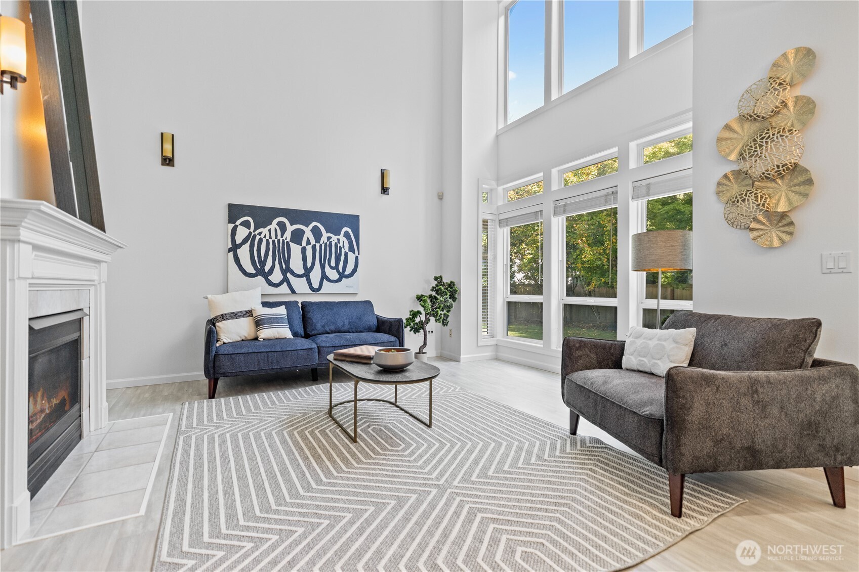5217 76th Ave Court West University Place, WA 98467 - Photo 14 of 36 a living room with furniture and a fireplace