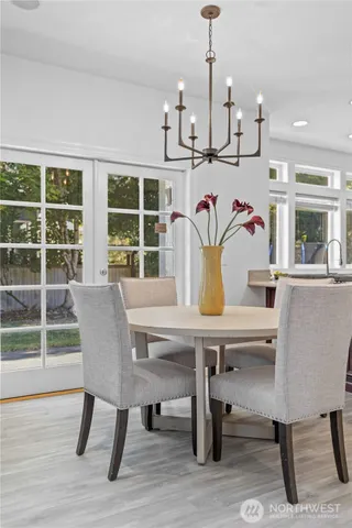 a view of a dining room with furniture window and outside view
