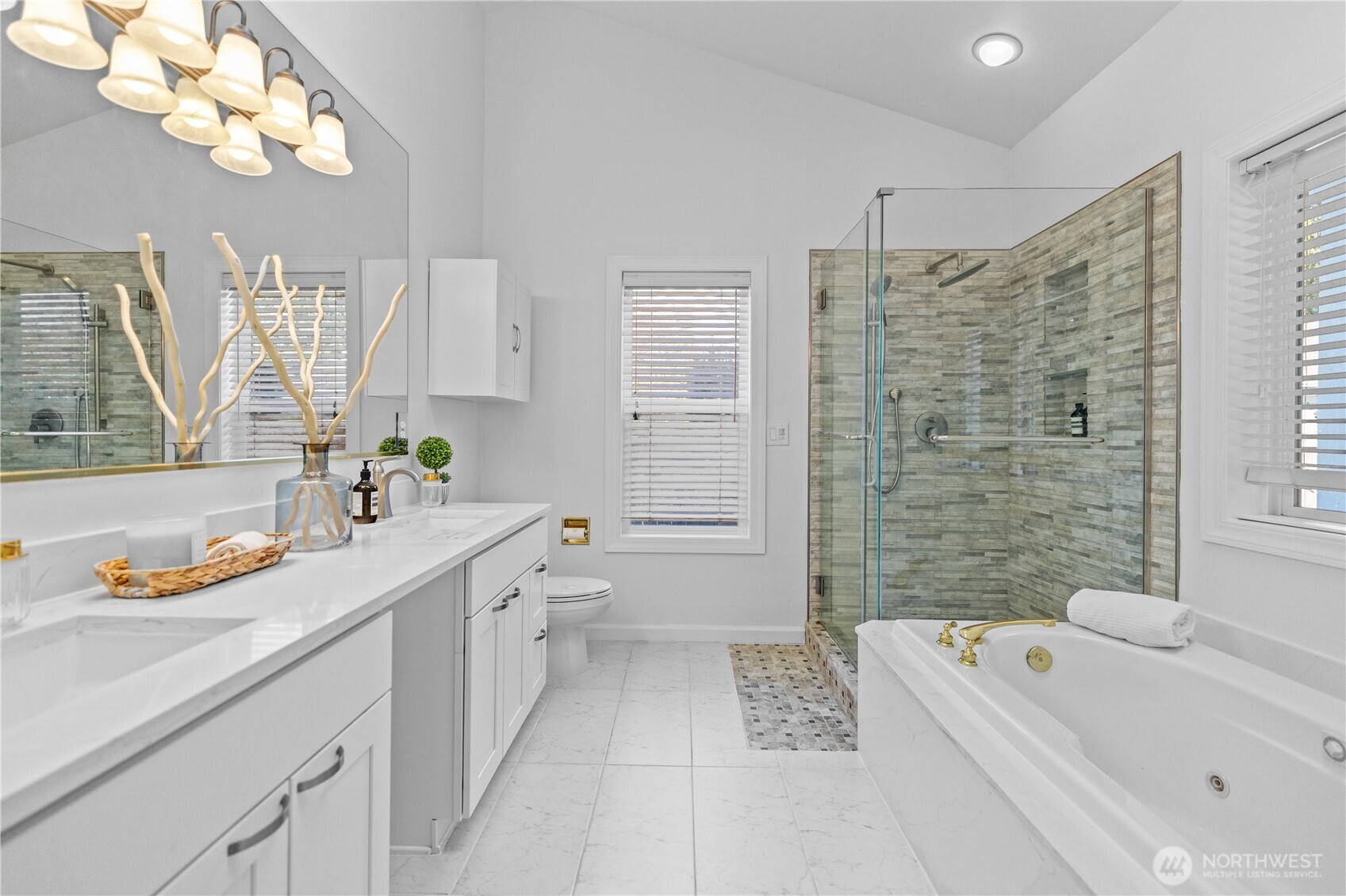 5217 76th Ave Court West University Place, WA 98467 - Photo 20 of 36 a bathroom with a tub a sink and a shower