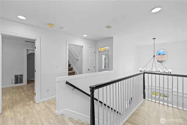 a view of a hallway view with staircase