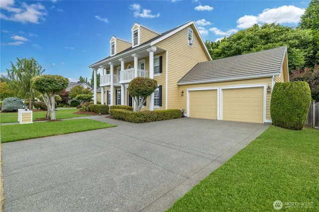 a front view of house with yard and green space