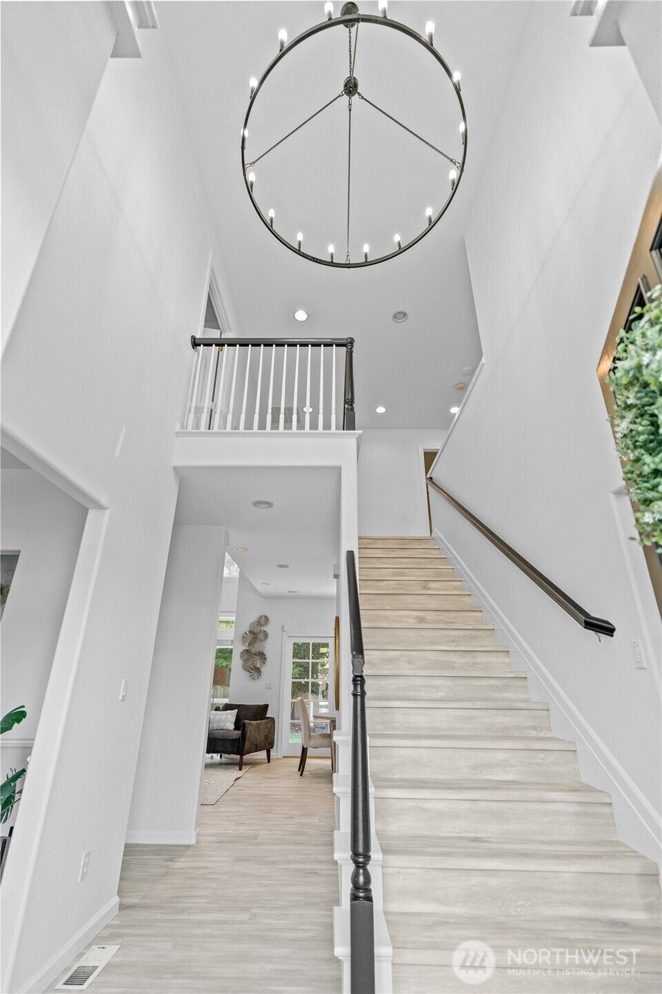 5217 76th Ave Court West University Place, WA 98467 - Photo 4 of 36 a view of an entryway wooden floor and a kitchen view