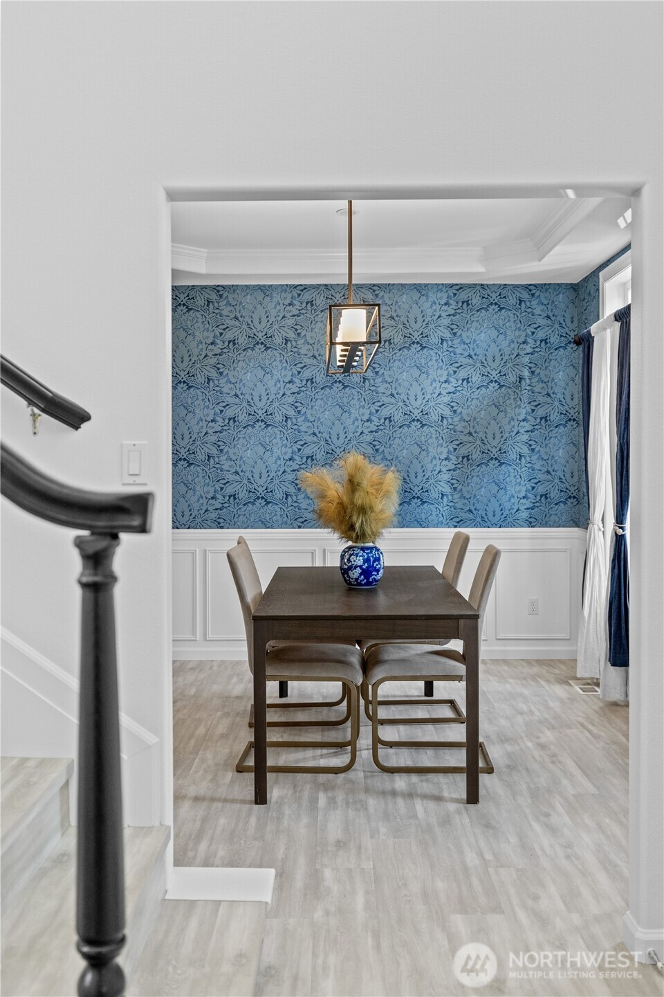 5217 76th Ave Court West University Place, WA 98467 - Photo 7 of 36 a view of a dining room with furniture and wooden floor