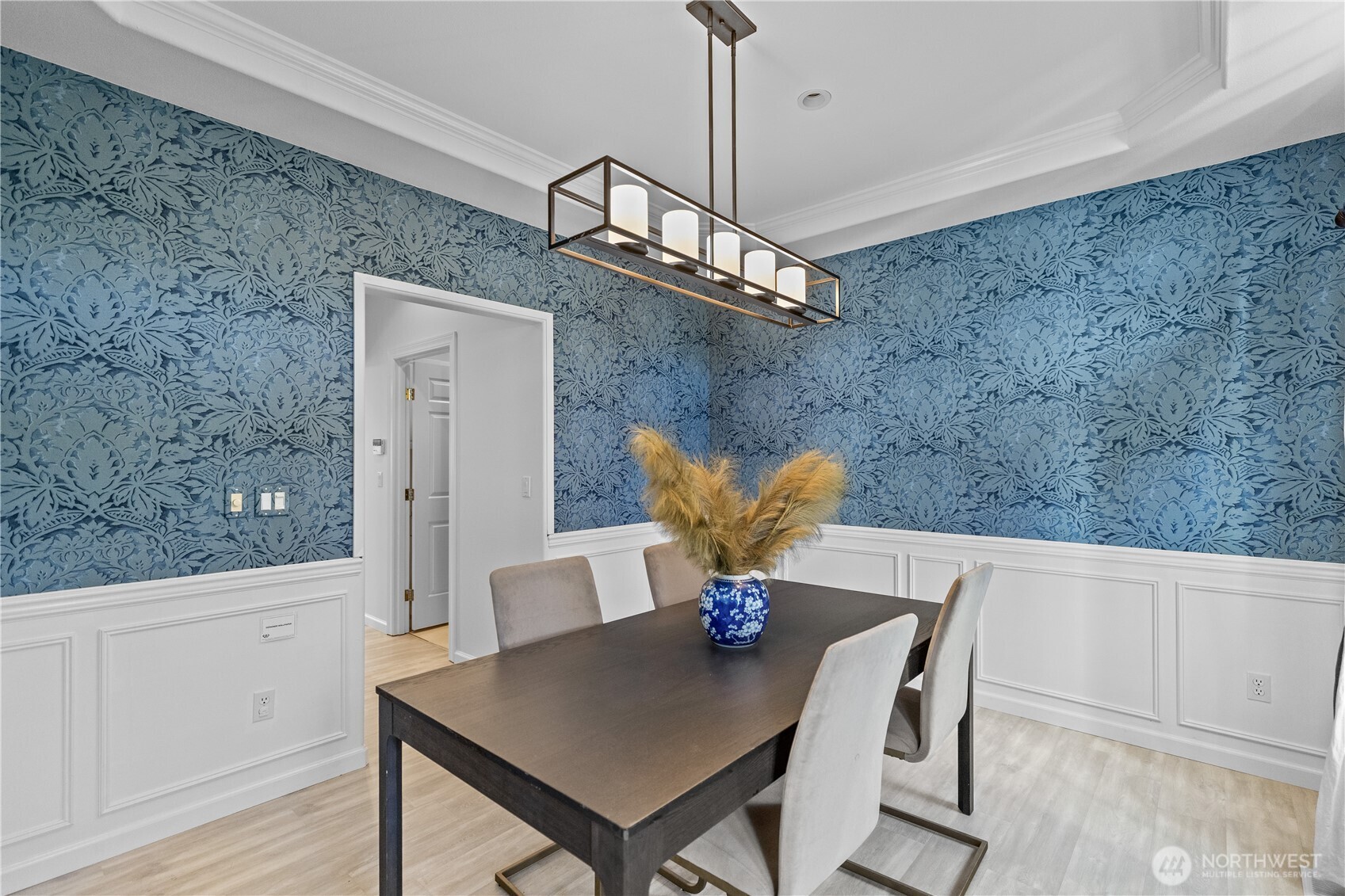 5217 76th Ave Court West University Place, WA 98467 - Photo 8 of 36 a view of a dining room with furniture and wooden floor