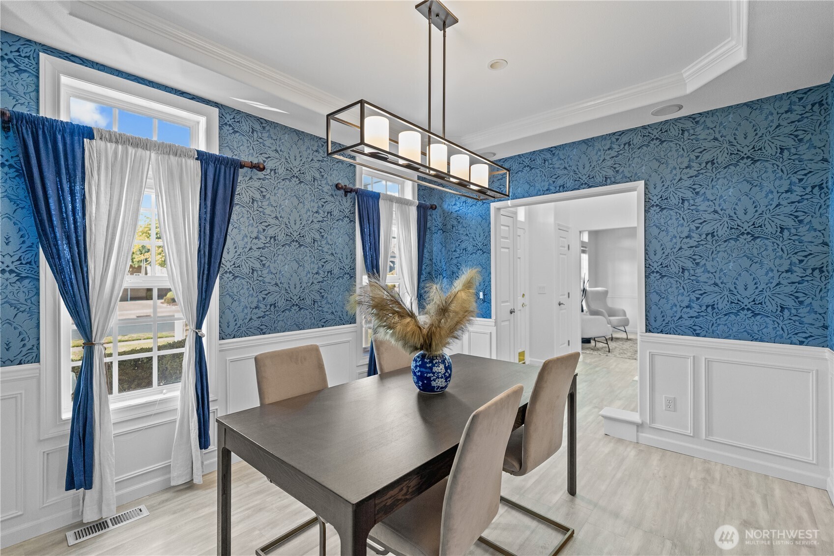 5217 76th Ave Court West University Place, WA 98467 - Photo 9 of 36 a view of a dining room with furniture window and wooden floor