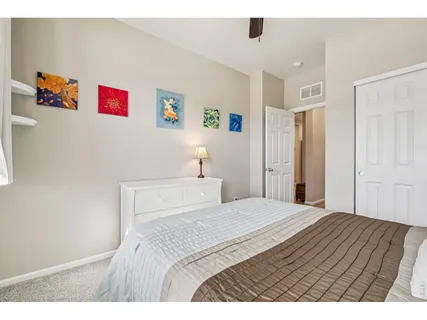 a bedroom with a bed and a cabinets