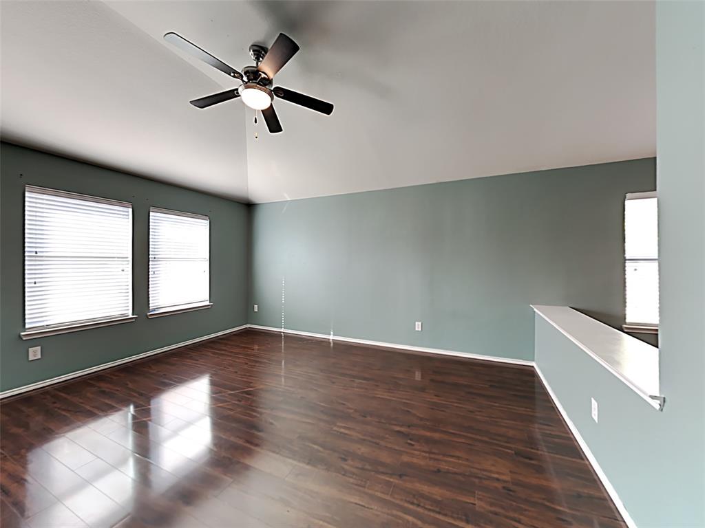 3251 Torio Grand Prairie, TX 75054 - Photo 3 of 17 a view of an empty room with wooden floor and a window
