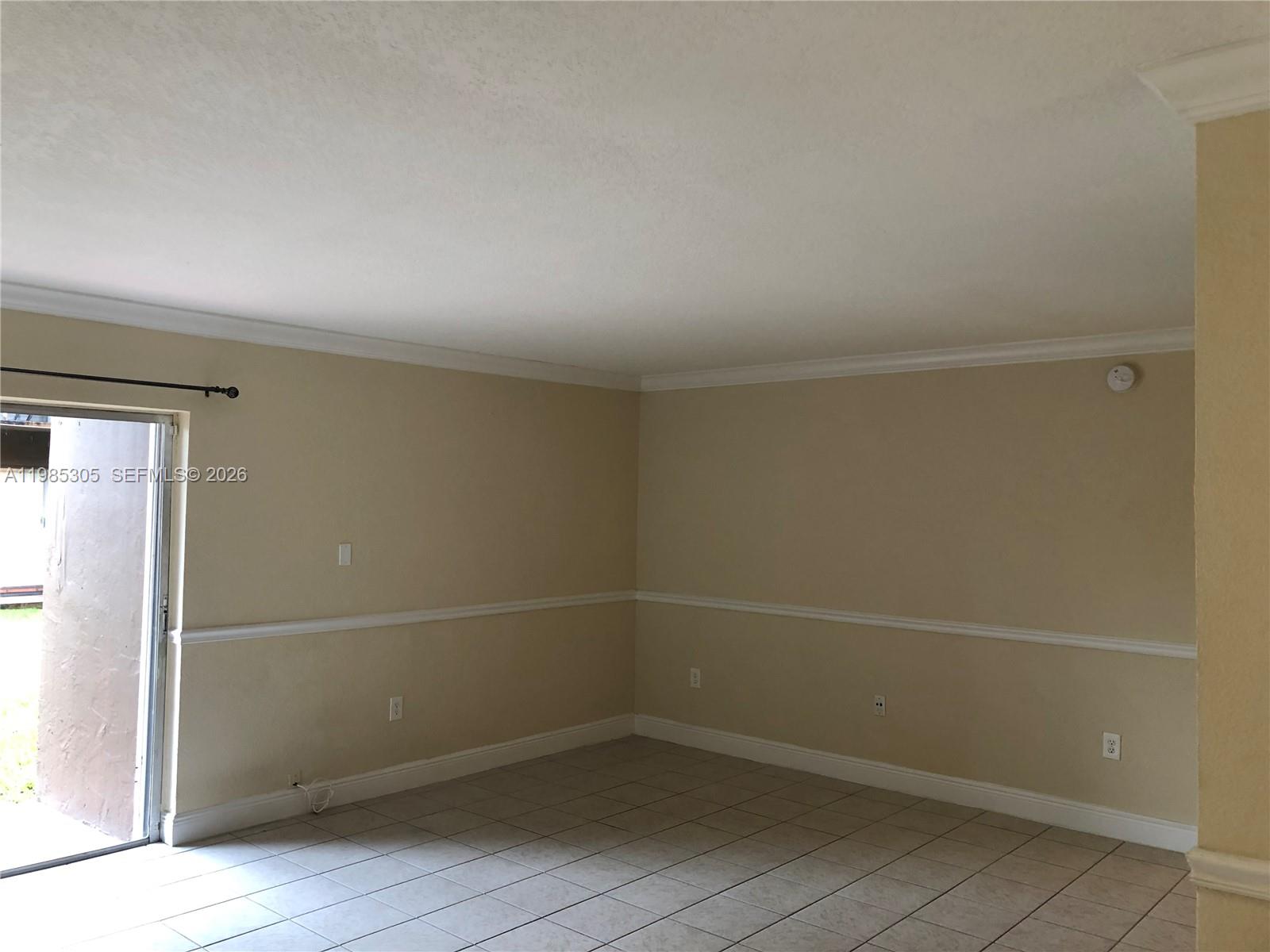 9467 Southwest 76th Street, Unit Q3 Miami, FL 33173 - Photo 12 of 18 a view of an empty room