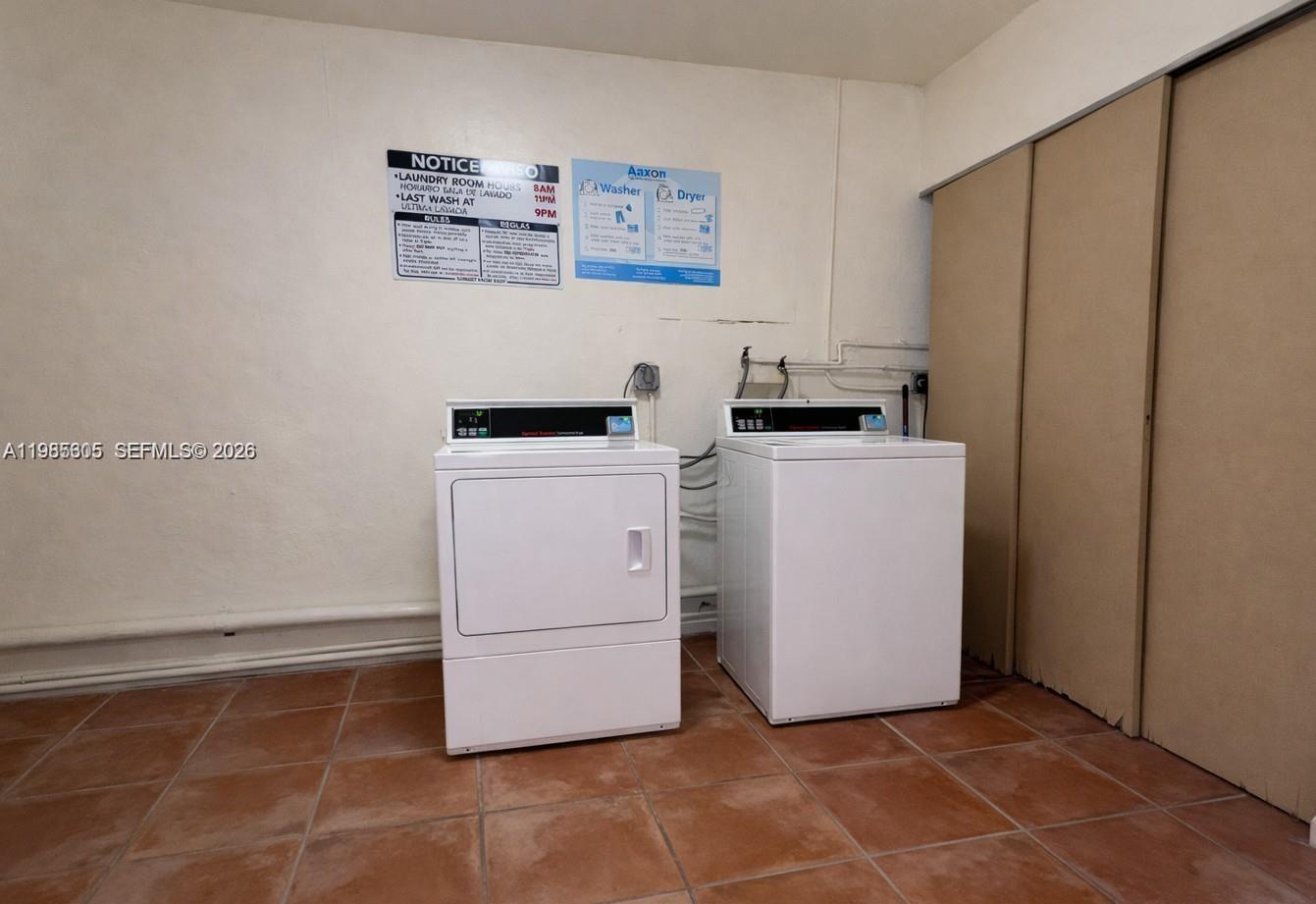 9467 Southwest 76th Street, Unit Q3 Miami, FL 33173 - Photo 18 of 18 a utility room with dryer and washer