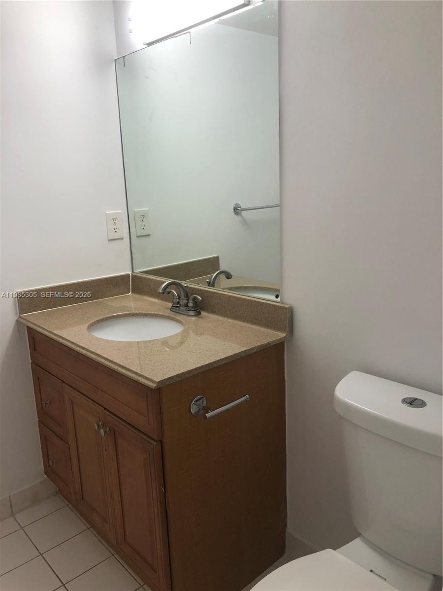 9467 Southwest 76th Street, Unit Q3 Miami, FL 33173 - Photo 9 of 18 a bathroom with a sink and a toilet