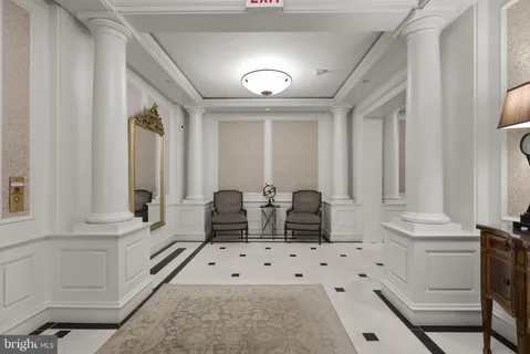 view of hall way with mirror and window