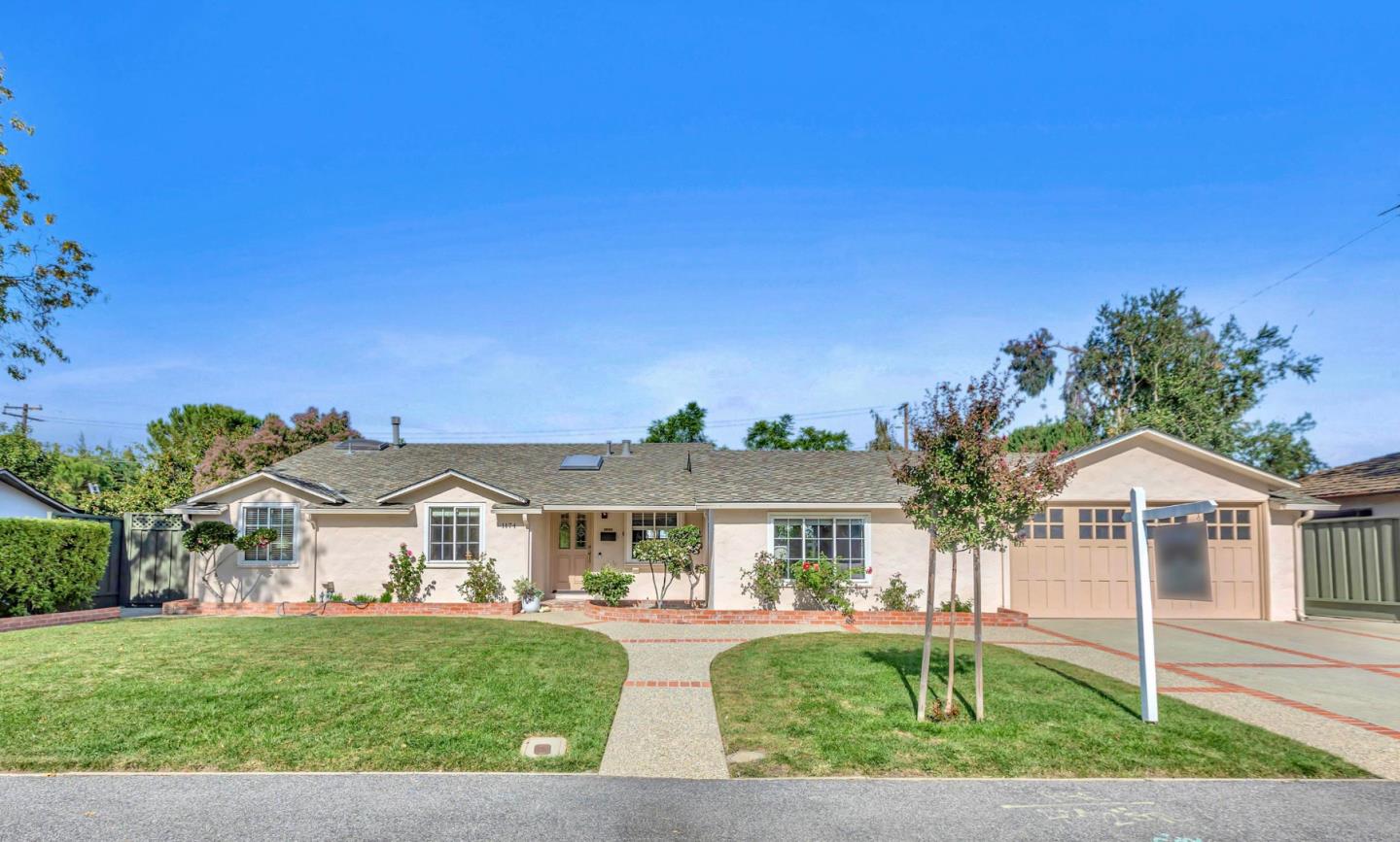 1174 Fordham Way Mountain View, CA 94040 - Photo 1 of 36 a front view of a house with a yard