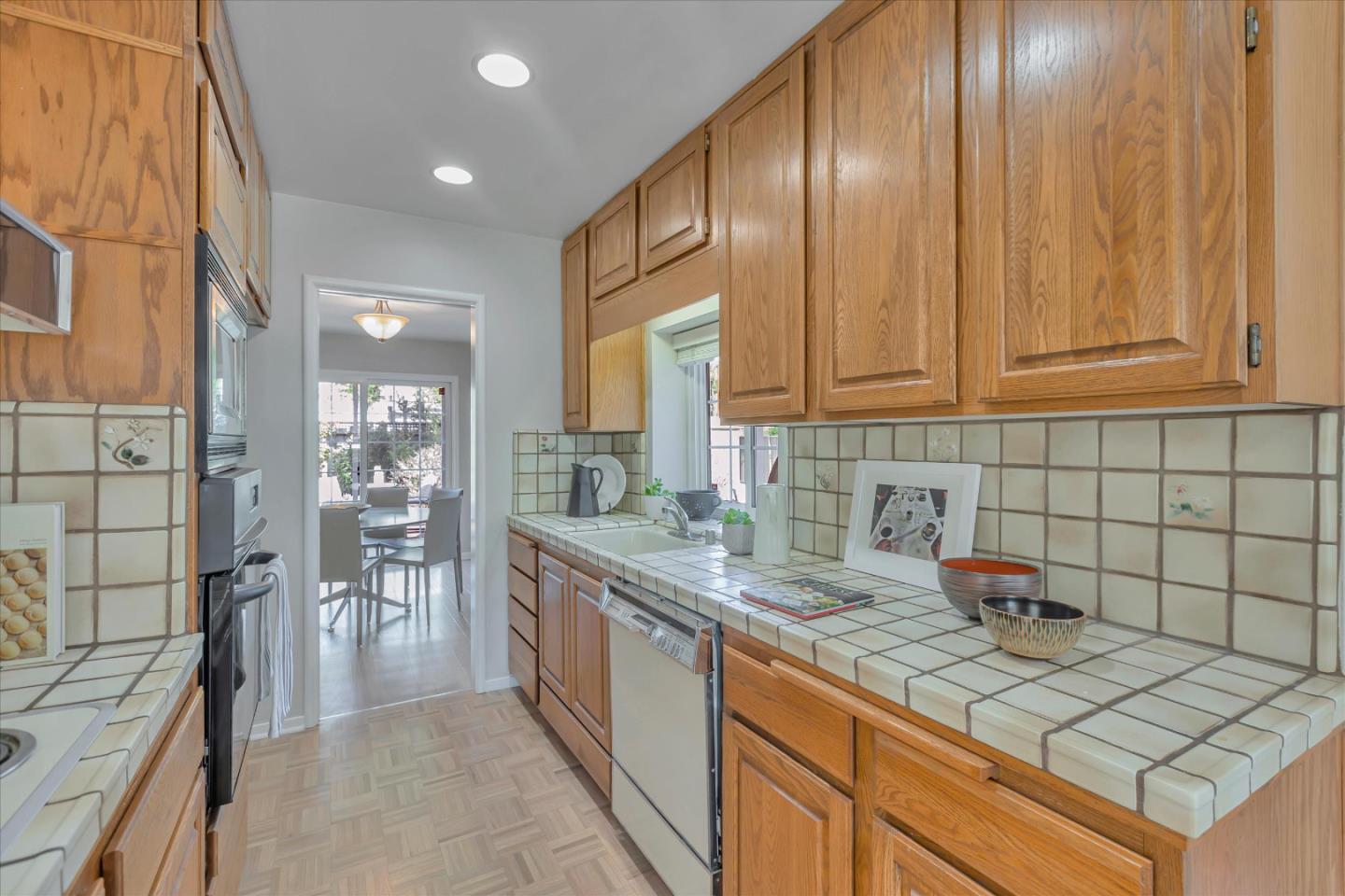 1174 Fordham Way Mountain View, CA 94040 - Photo 13 of 36 a kitchen with stainless steel appliances granite countertop a sink stove and cabinets
