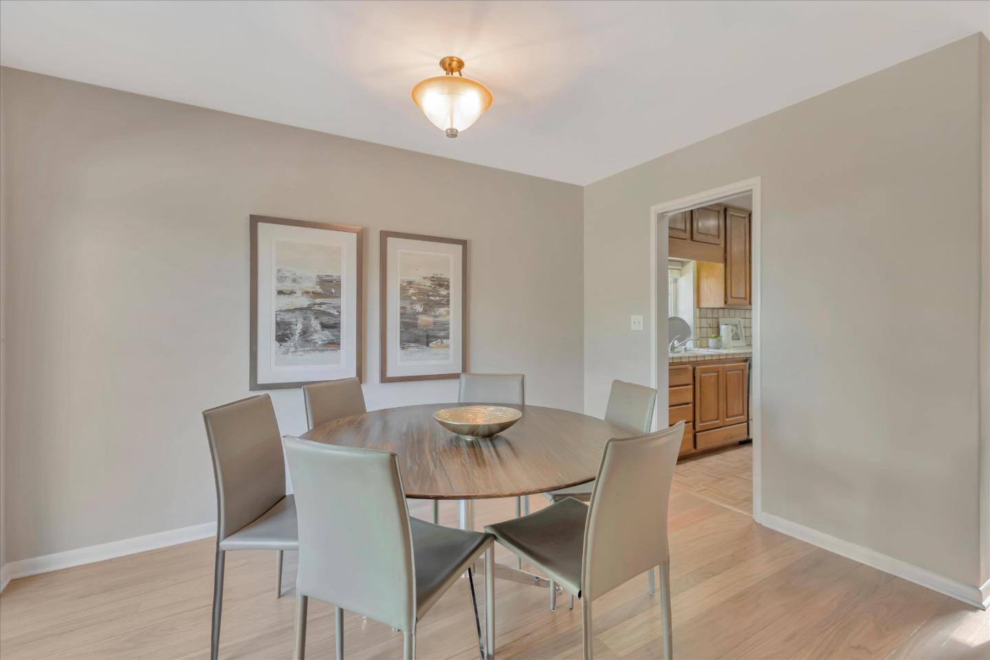 1174 Fordham Way Mountain View, CA 94040 - Photo 16 of 36 a dining room with furniture and window