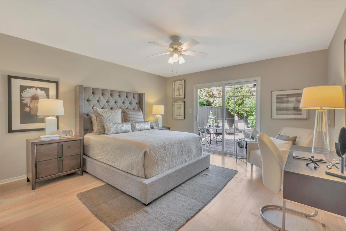 1174 Fordham Way Mountain View, CA 94040 - Photo 24 of 36 a bedroom with a large bed and a chandelier