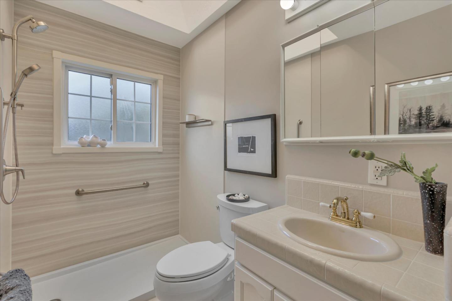 1174 Fordham Way Mountain View, CA 94040 - Photo 27 of 36 a bathroom with a sink a toilet and shower