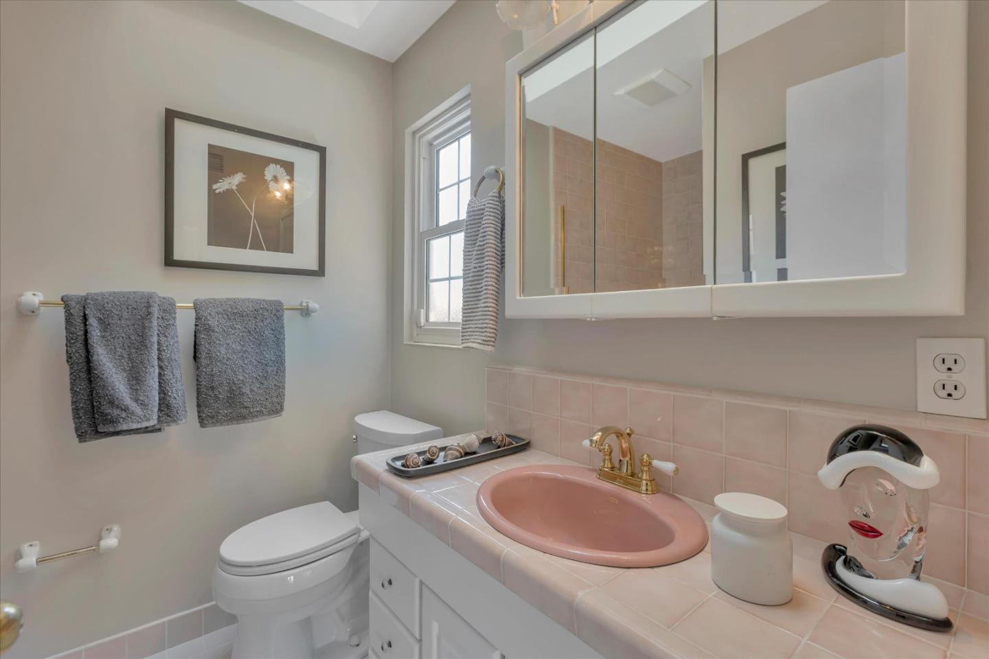 1174 Fordham Way Mountain View, CA 94040 - Photo 29 of 36 a bathroom with a toilet a sink and mirror