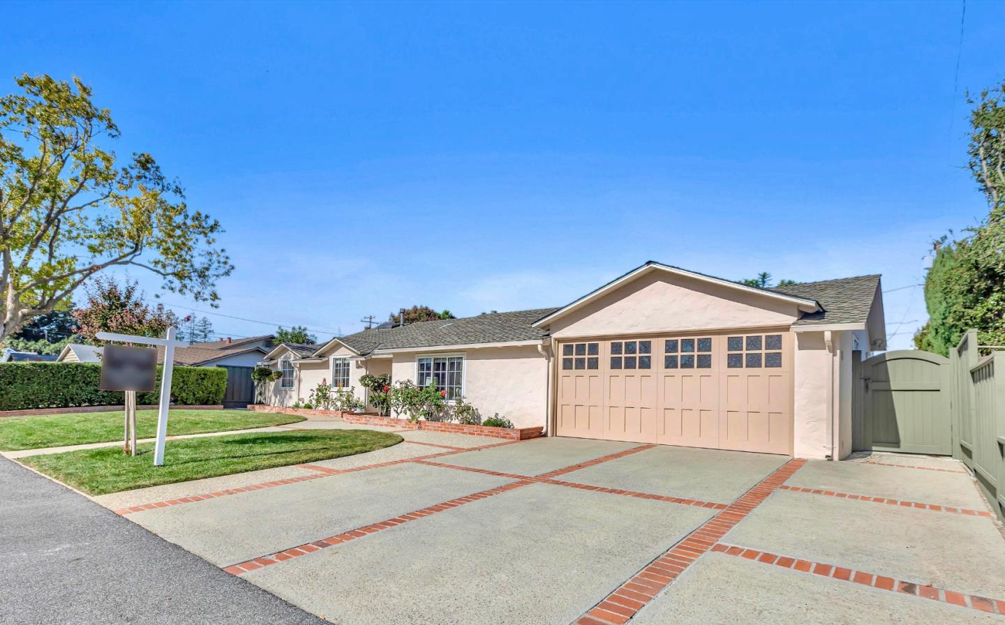 1174 Fordham Way Mountain View, CA 94040 - Photo 3 of 36 a front view of a house with a garden