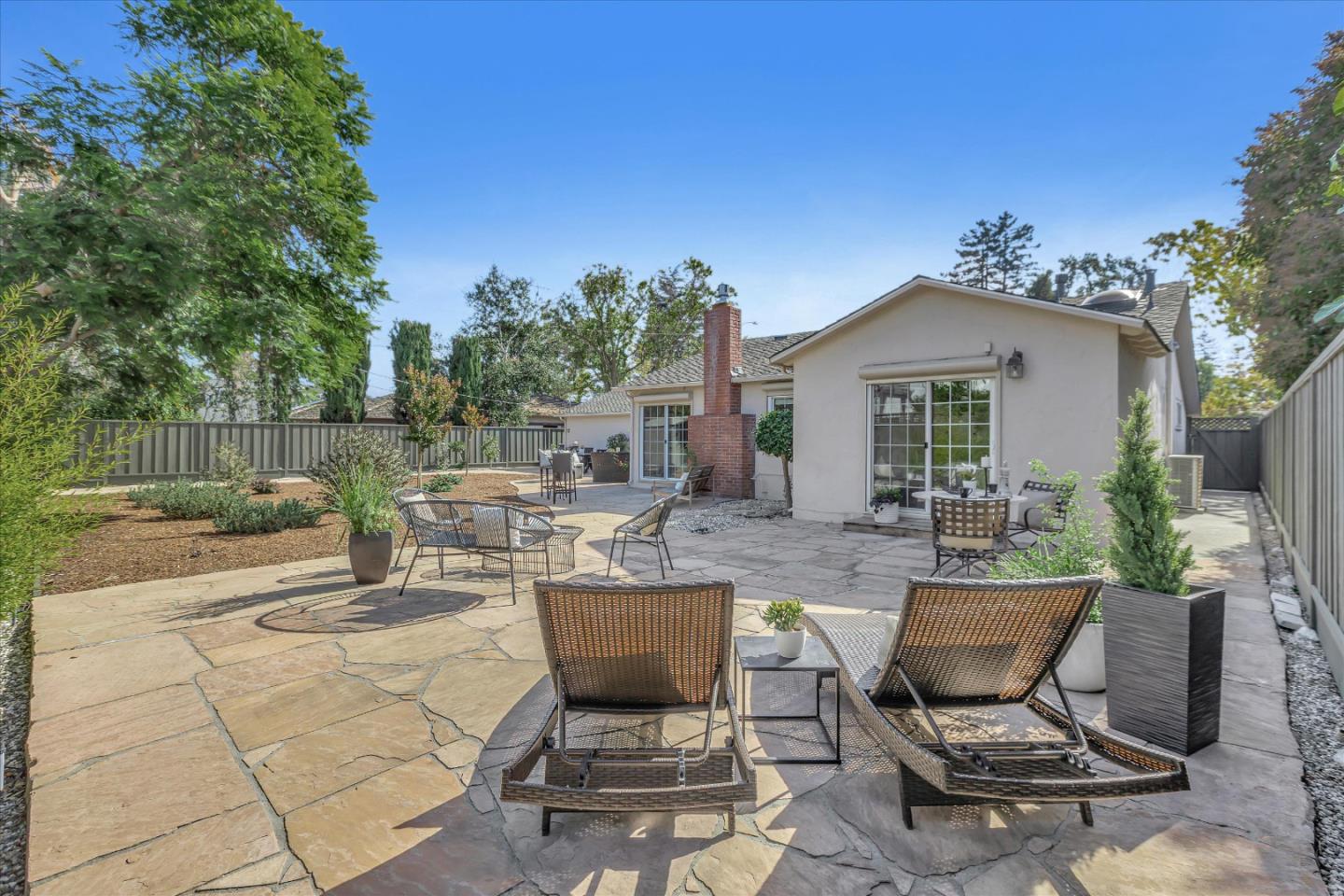 1174 Fordham Way Mountain View, CA 94040 - Photo 31 of 36 a view of a patio with table and chairs and potted plants