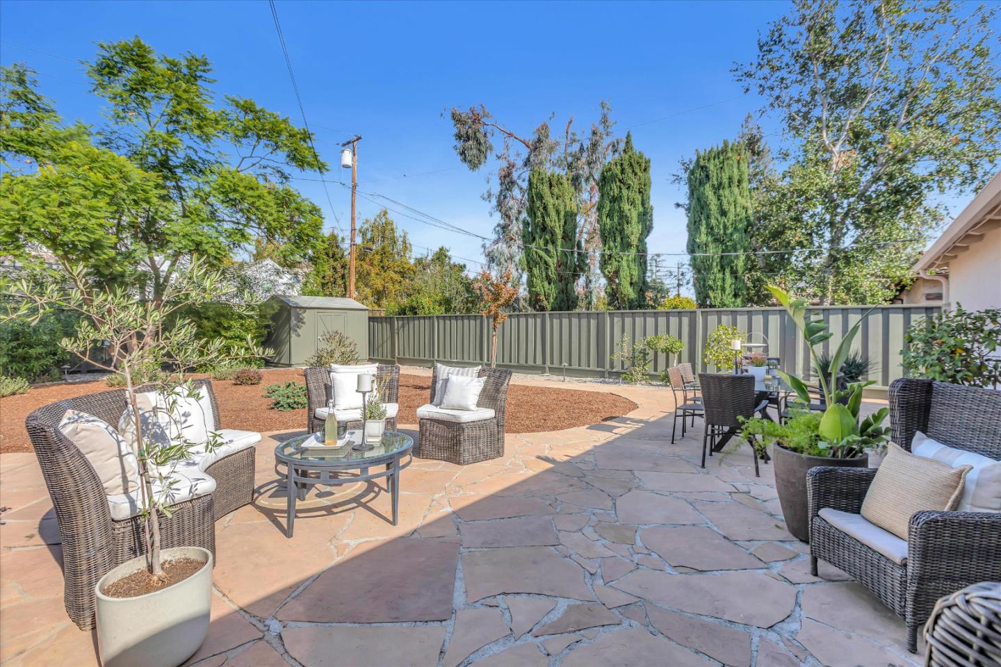 1174 Fordham Way Mountain View, CA 94040 - Photo 36 of 36 a view of a patio with couches table and chairs and potted plants