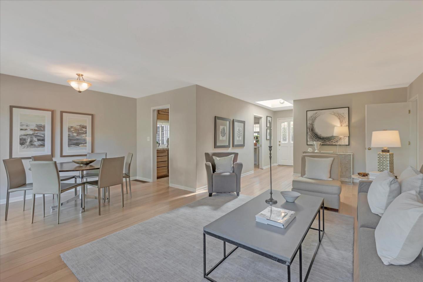 1174 Fordham Way Mountain View, CA 94040 - Photo 5 of 36 a living room with furniture a wooden floor and a table