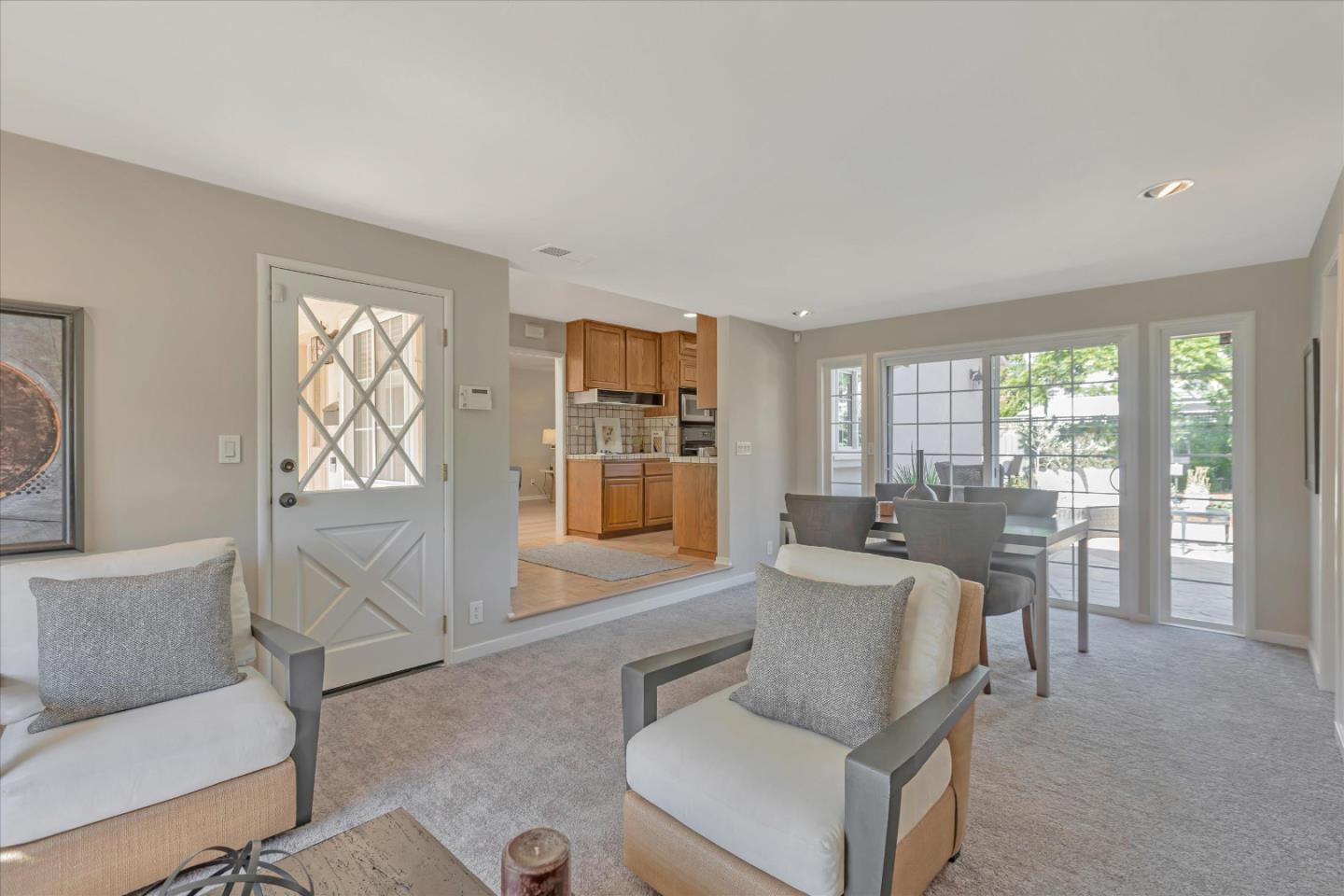 1174 Fordham Way Mountain View, CA 94040 - Photo 9 of 36 a living room with furniture and large windows