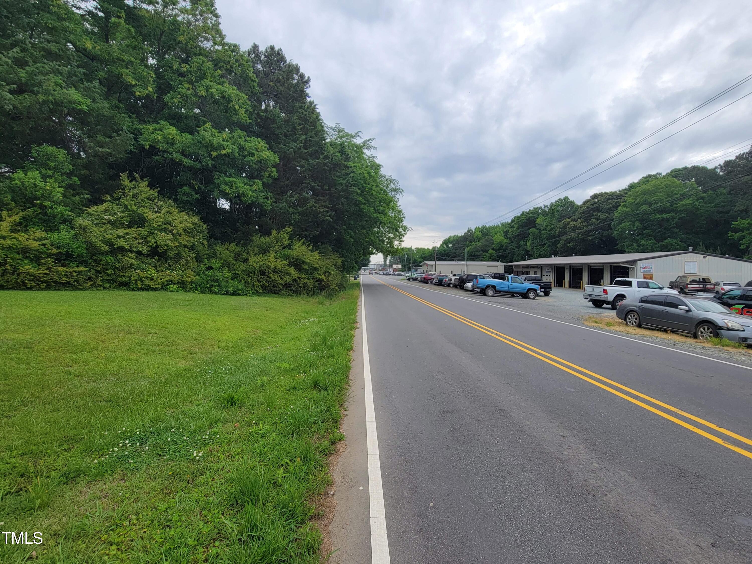 Tbd East 3rd Street Siler City, NC 27344 - Photo 12 of 23 a view of a city street with a building and trees in the background