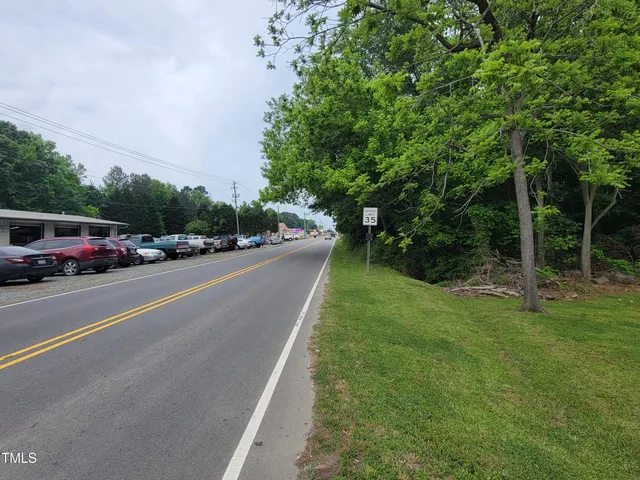 a view of street with parked cars