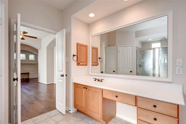 a spacious bathroom with a double vanity sink mirror and