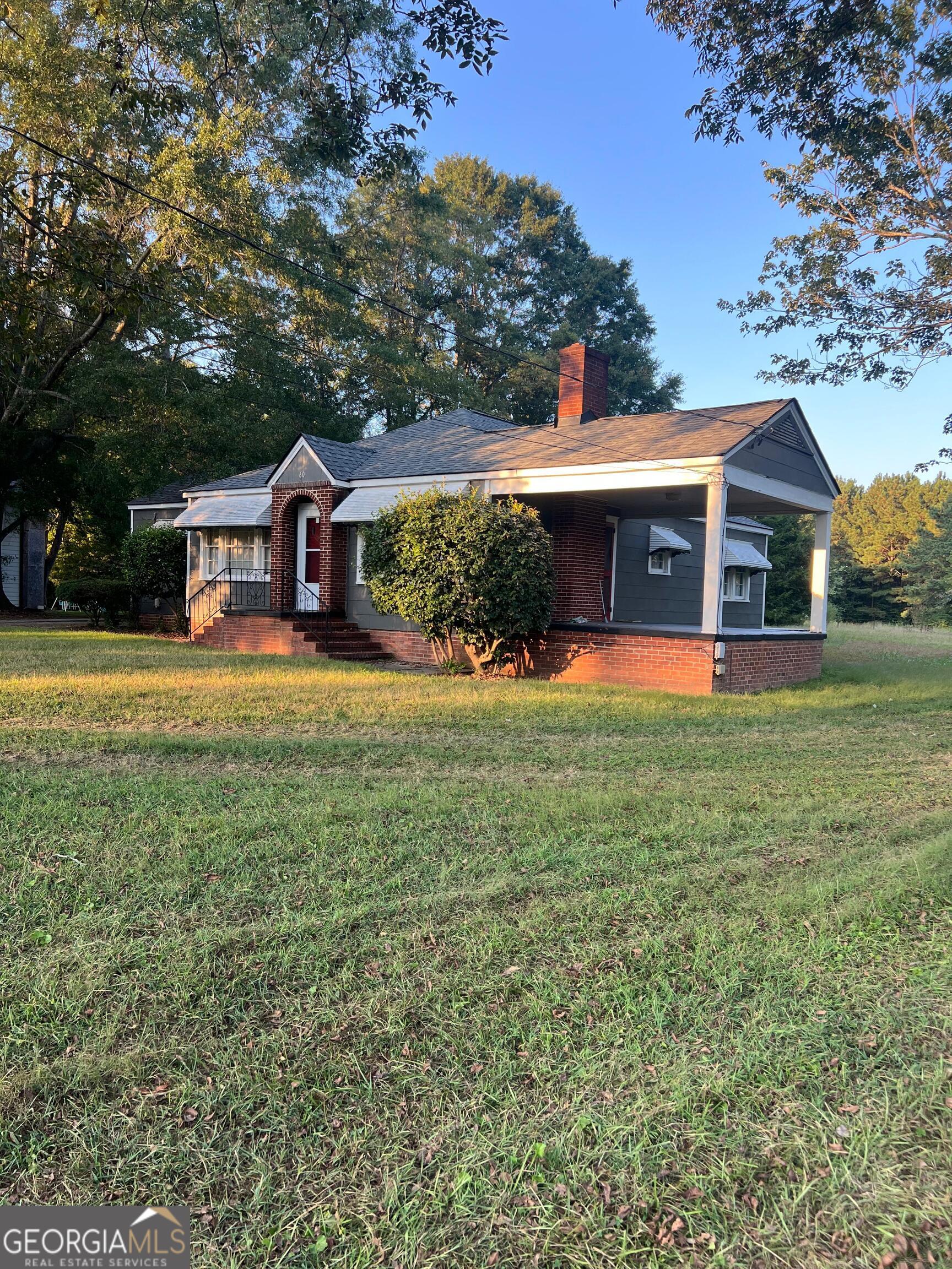 front view of a house with a yard