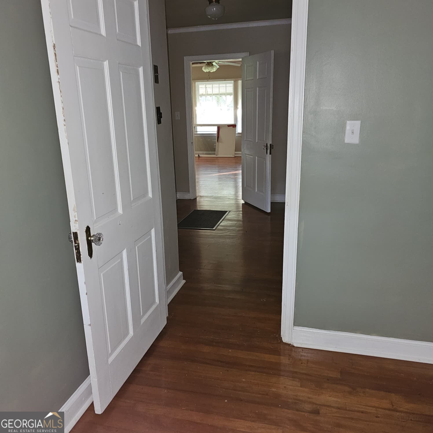 60 North East Main Street Hampton, GA 30228 - Photo 9 of 17 a view of a hallway with wooden floor