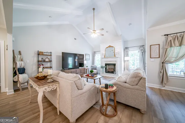 a spacious bedroom with a bed couch and dresser