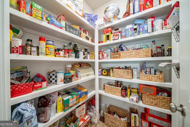 a bathroom with a sink a shower a mirror and a bathtub