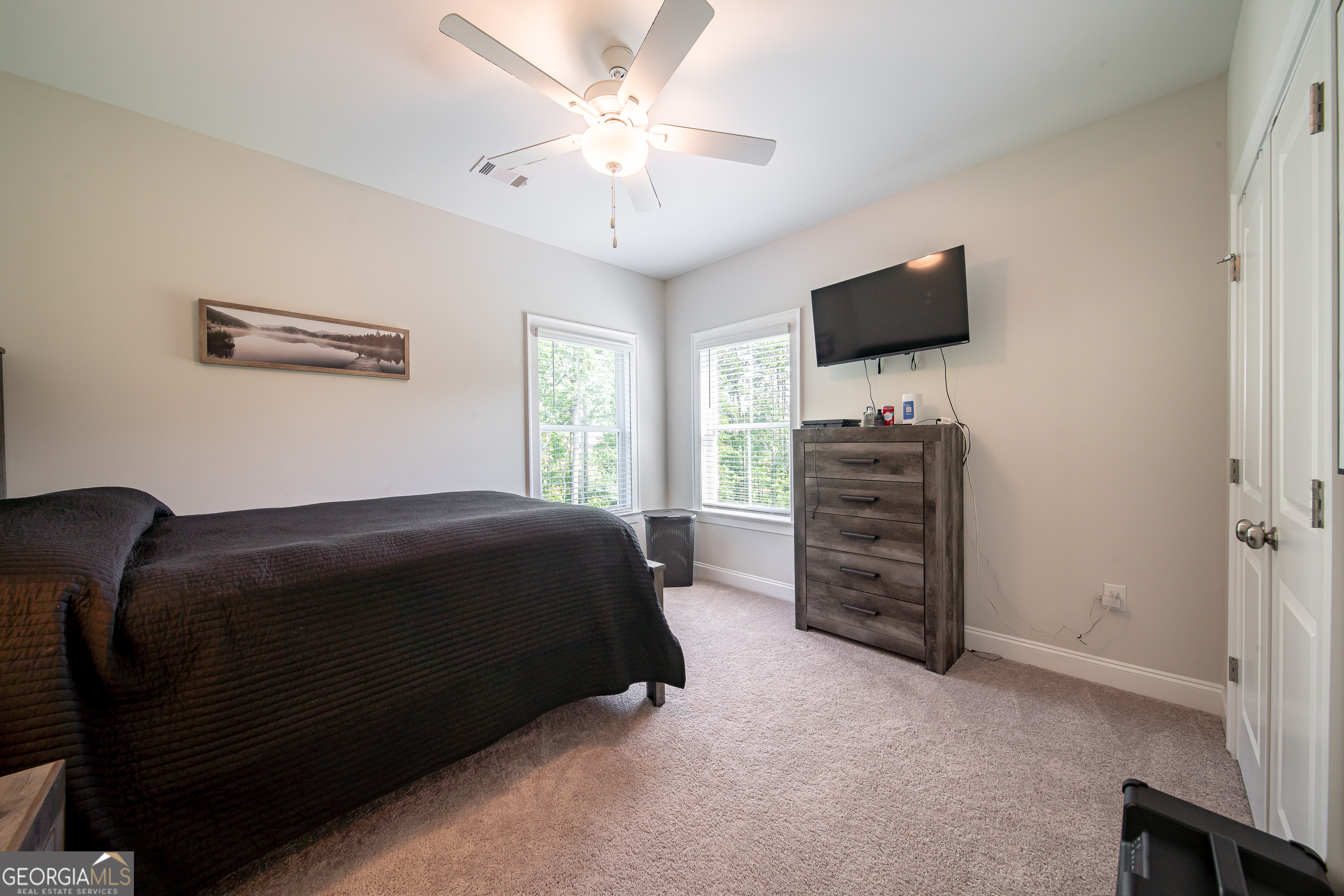 96 Cypress Trail Fortson, GA 31808 - Photo 34 of 62 a bedroom with a bed and a flat screen tv
