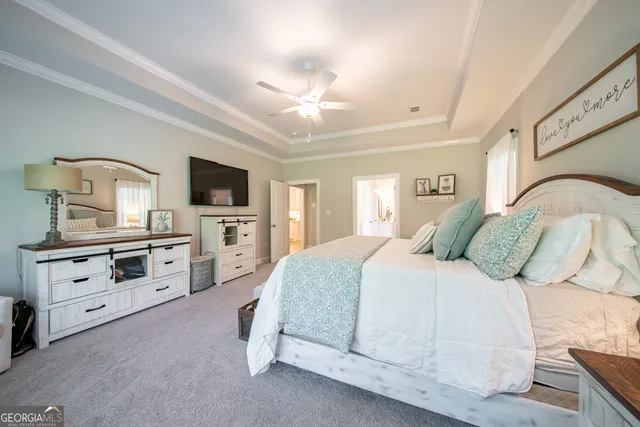 a bathroom with a sink mirror and toilet