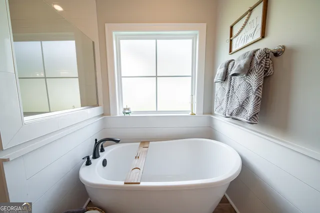a view of hallway with wooden floor