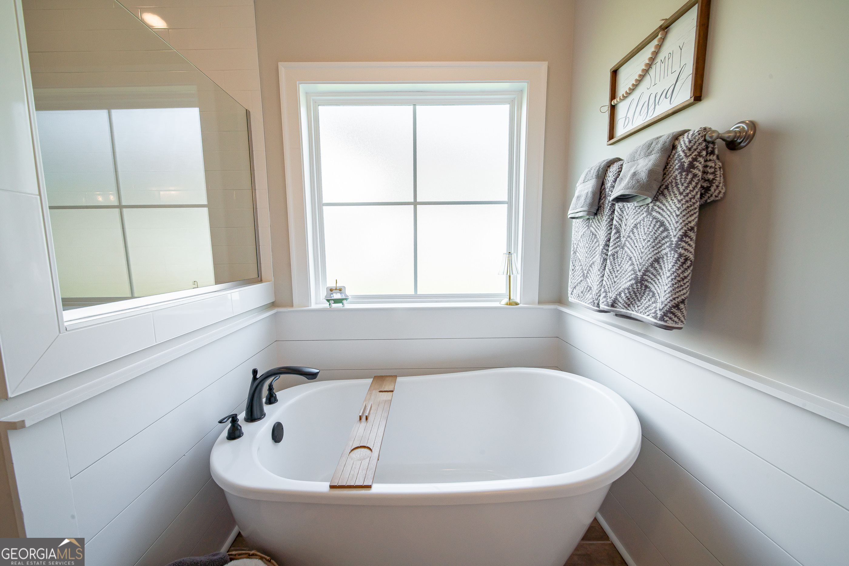 96 Cypress Trail Fortson, GA 31808 - Photo 40 of 62 a white bath tub sitting next to a window